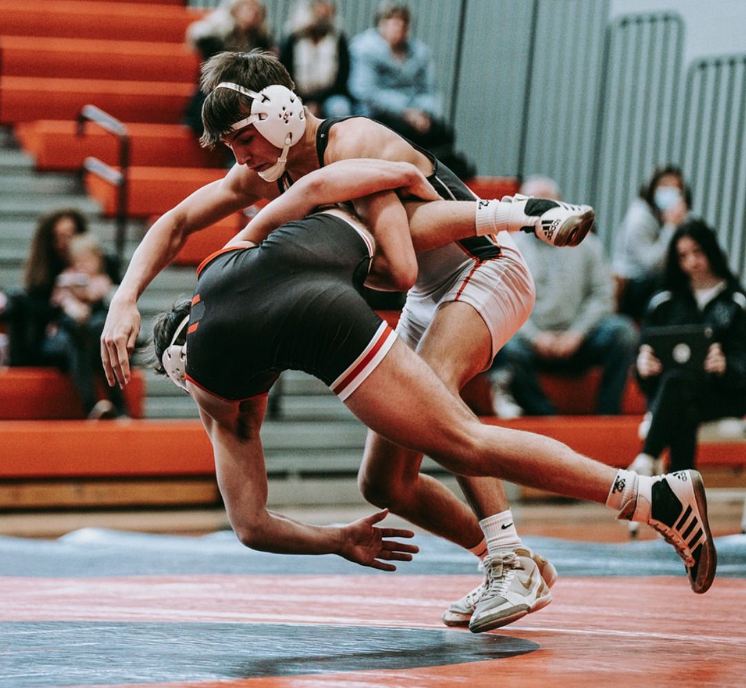 A Northampton wrestler drives through a shot