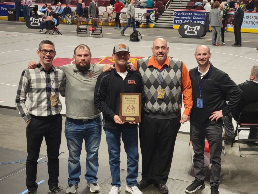Coaches with the 2022 Pennsylvania Junior High Coach of the Year plaque