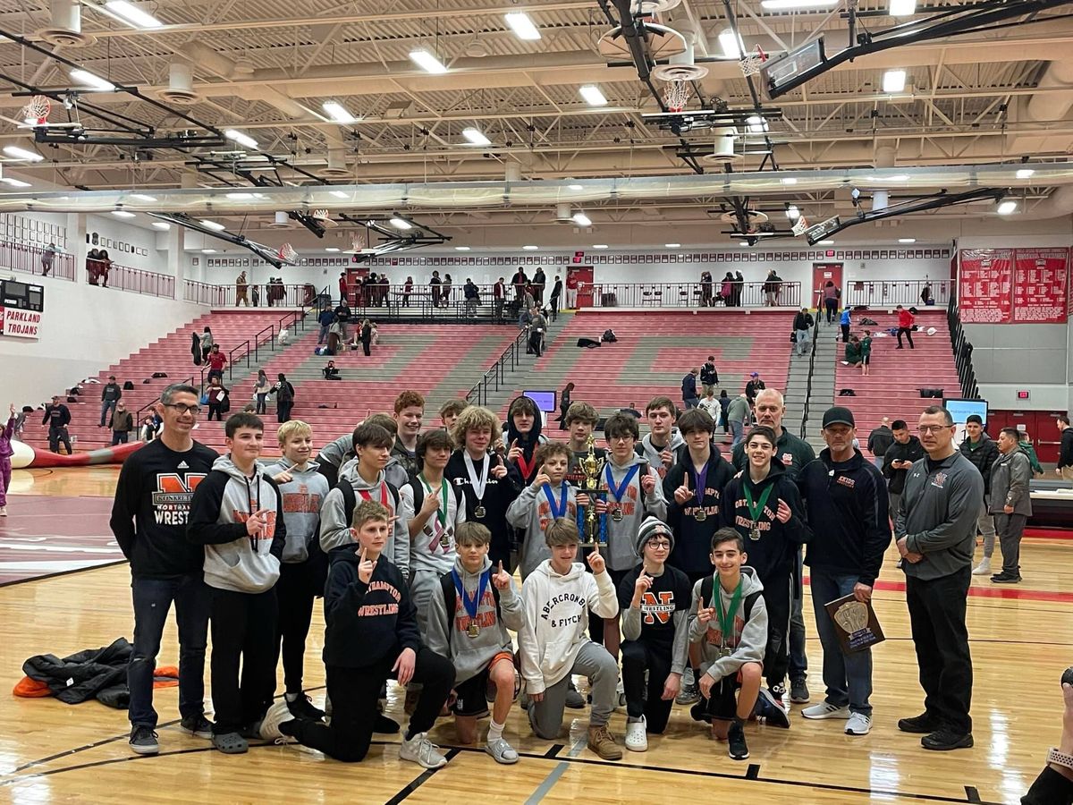 The 2021–22 junior high team with its District XI championship trophy