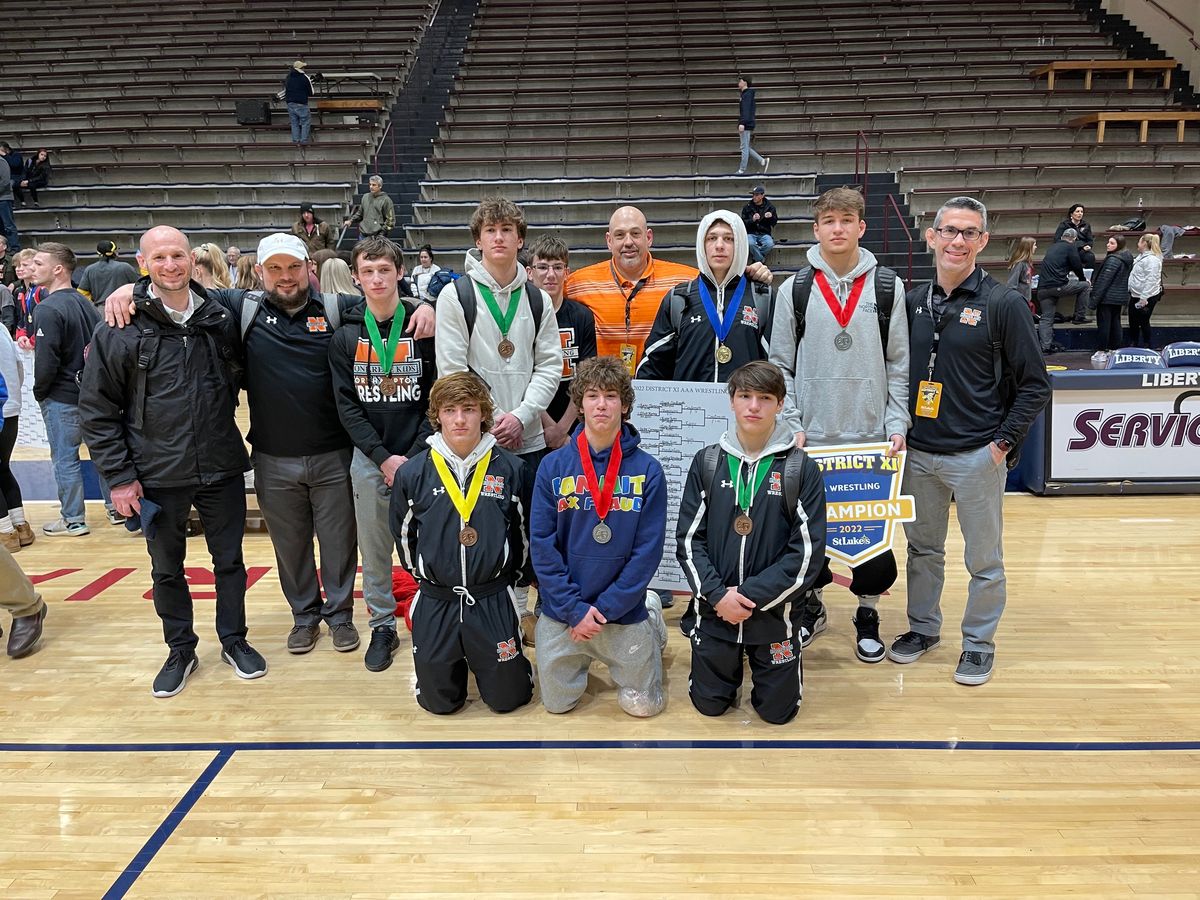 Junior high wrestlers with their medals at the district tournament