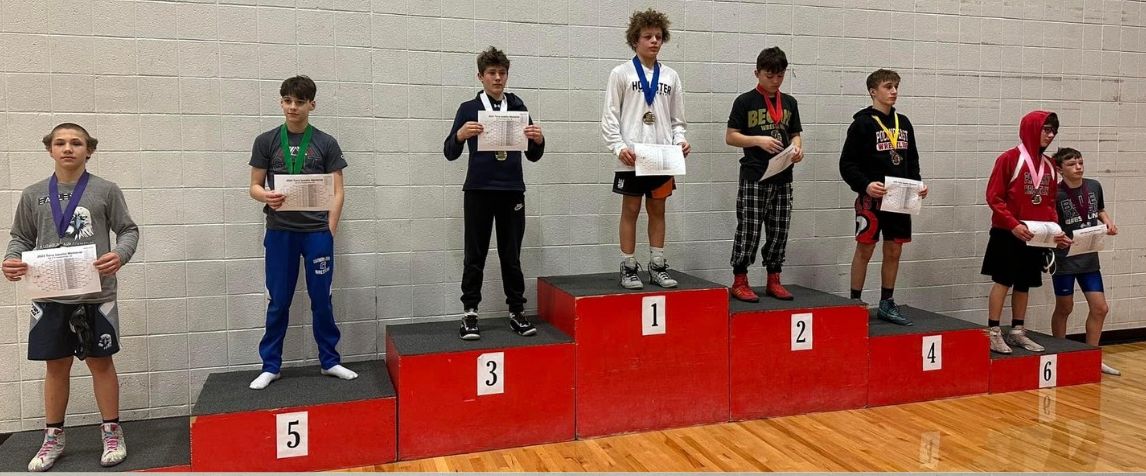 Junior high wrestlers on the district medal stand