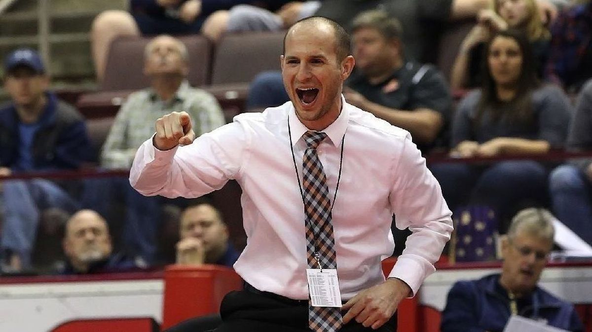 Coach Seth Lisa celebrates from the corner