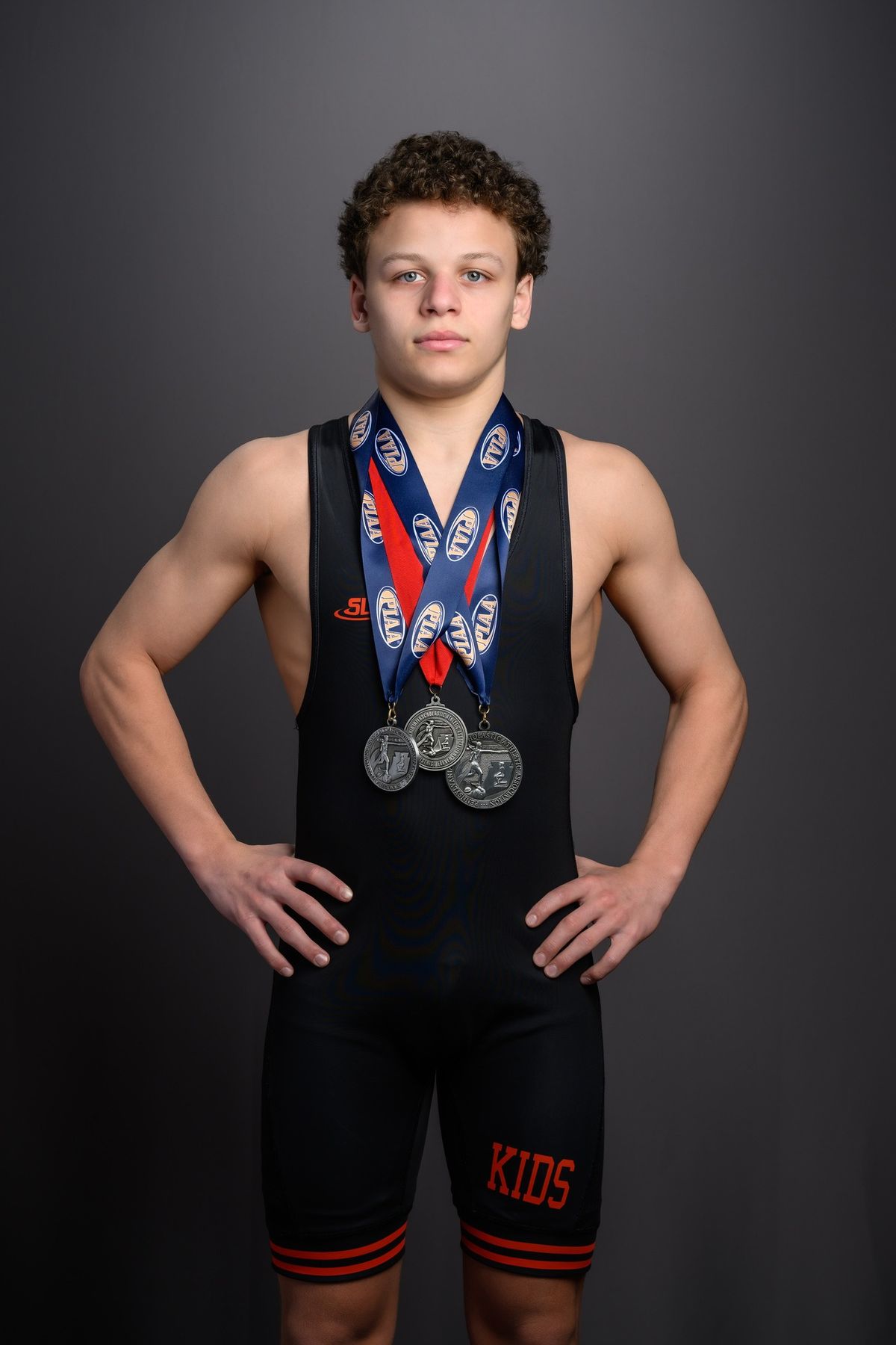 Gabe Ballard in his Northampton singlet wearing his postseason medals