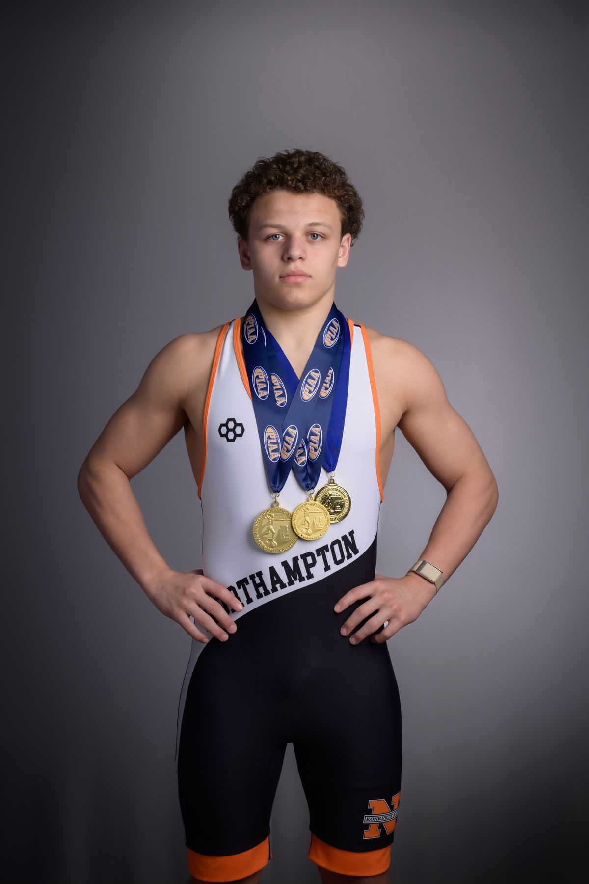 Gabe Ballard in his Northampton singlet wearing his postseason medals