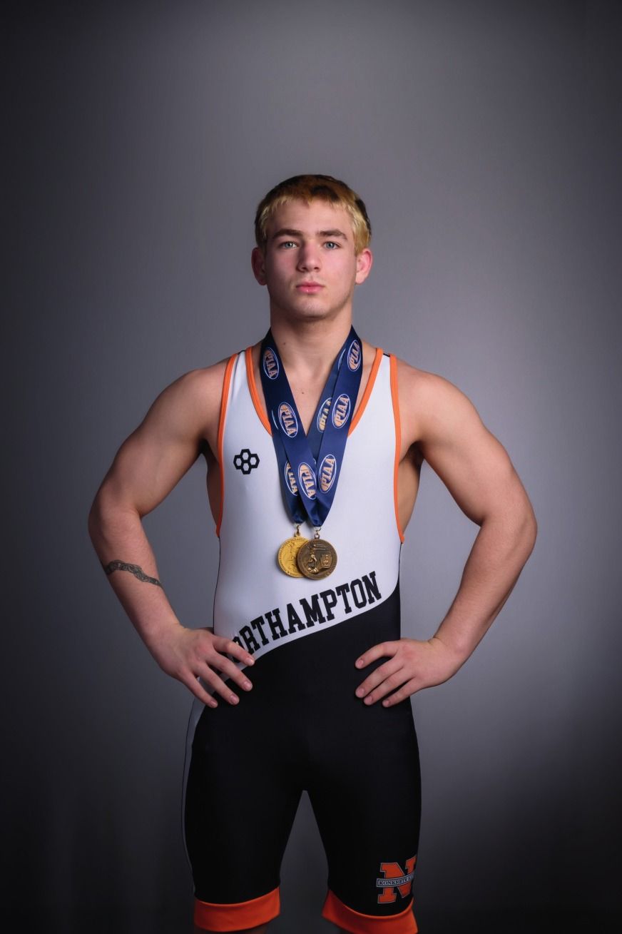 Carter Chlebove in his Northampton singlet wearing his postseason medals