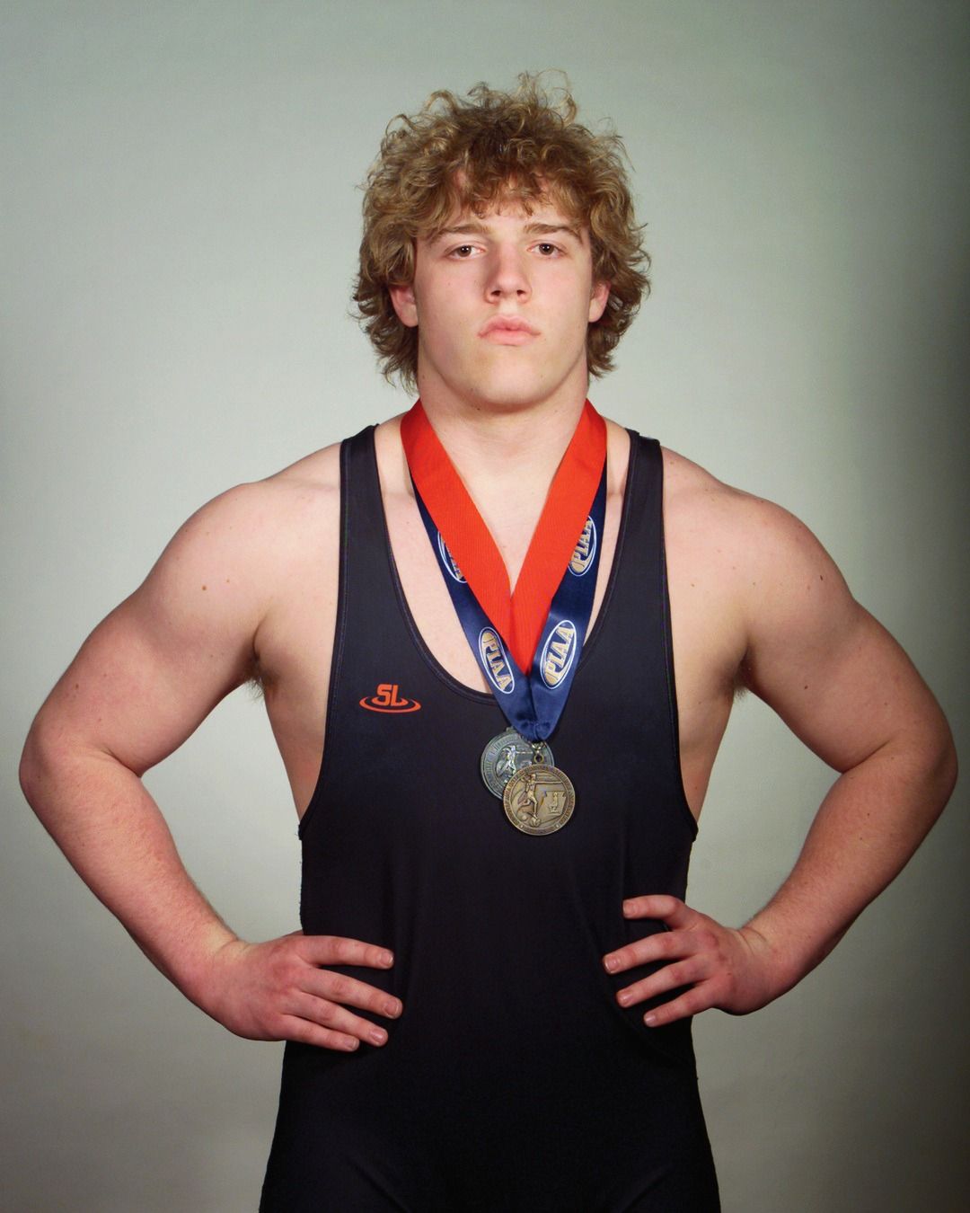 Gavin Grell in his Northampton singlet wearing his postseason medals