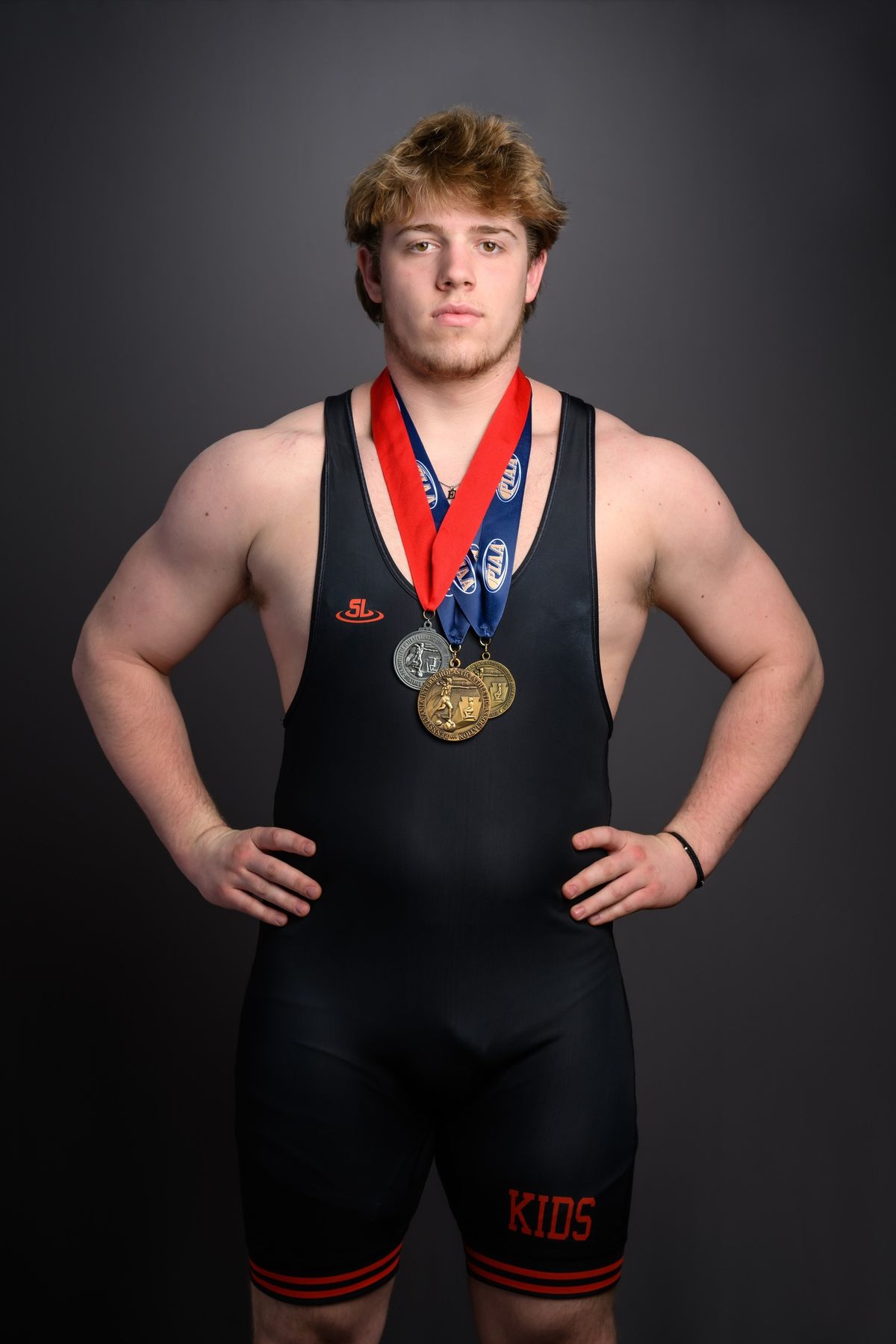 Gavin Grell in his Northampton singlet wearing his postseason medals