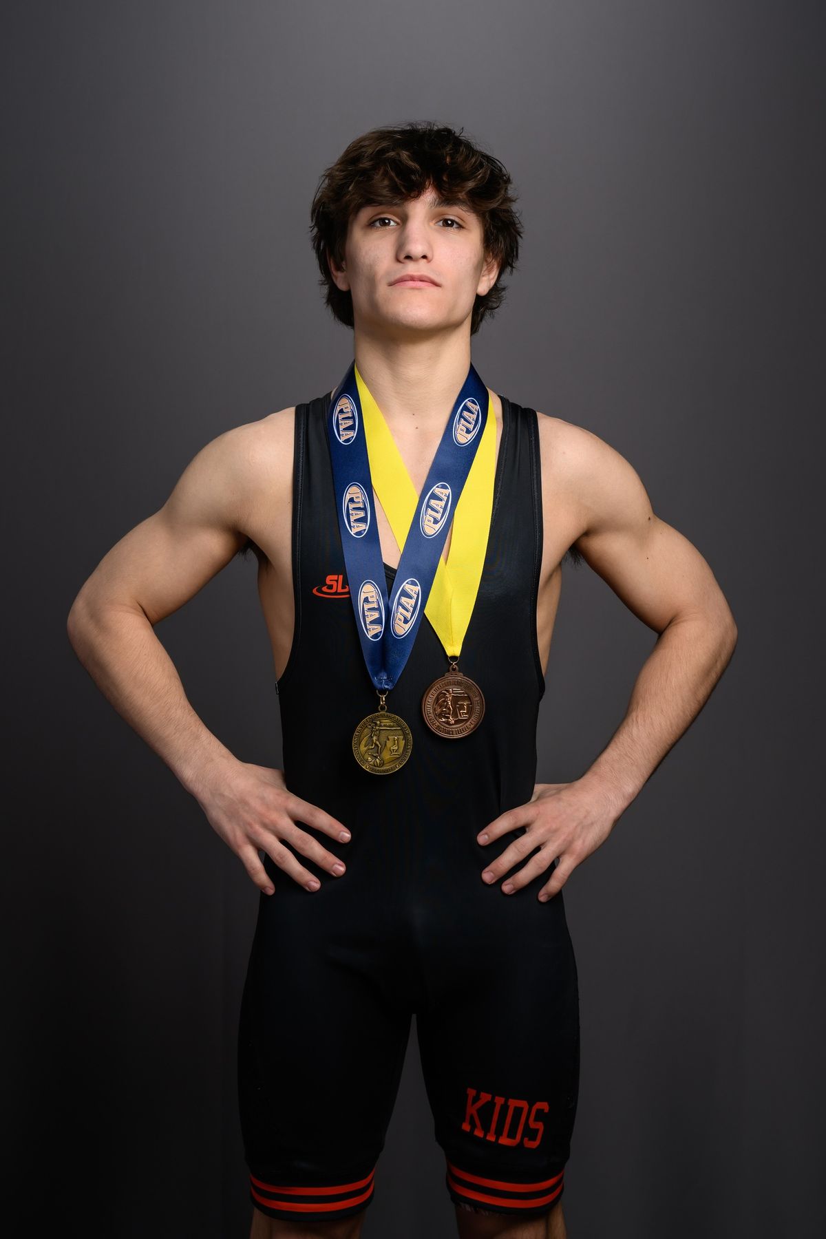Ryan Marano in his Northampton singlet wearing his postseason medals