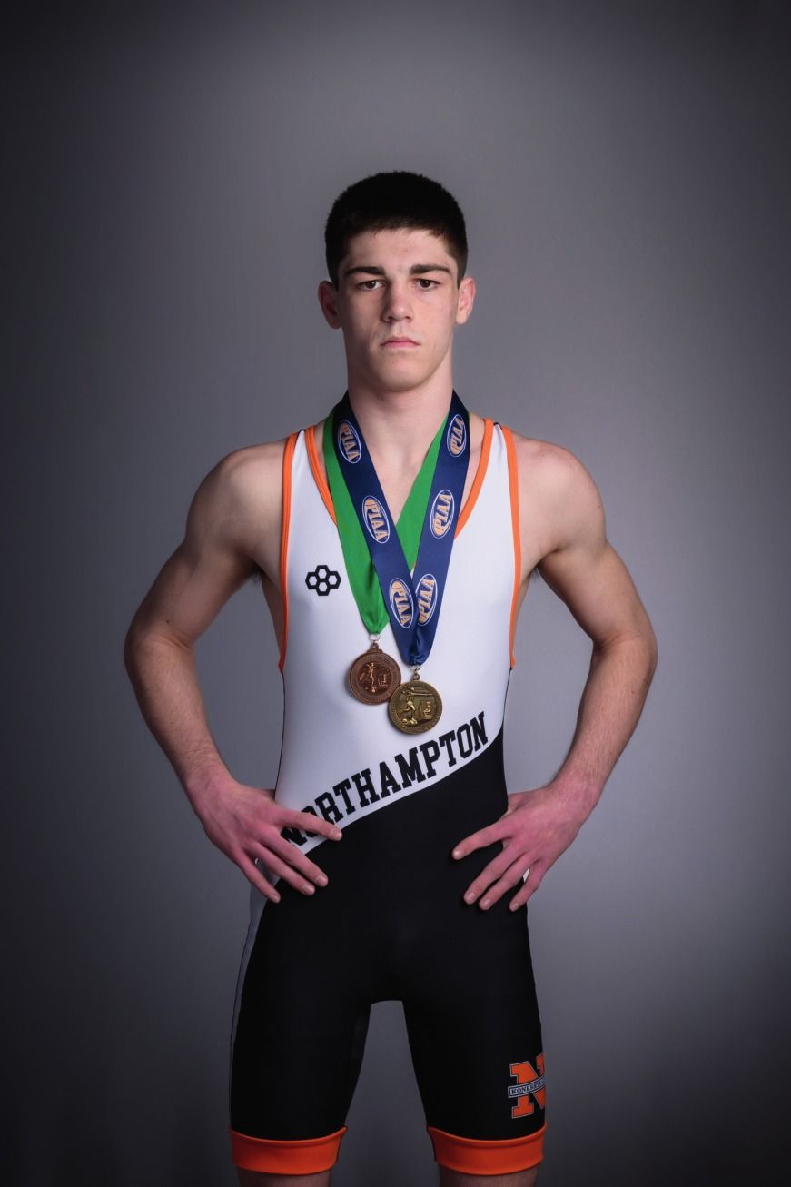 Matthew Sommer in his Northampton singlet wearing his postseason medals