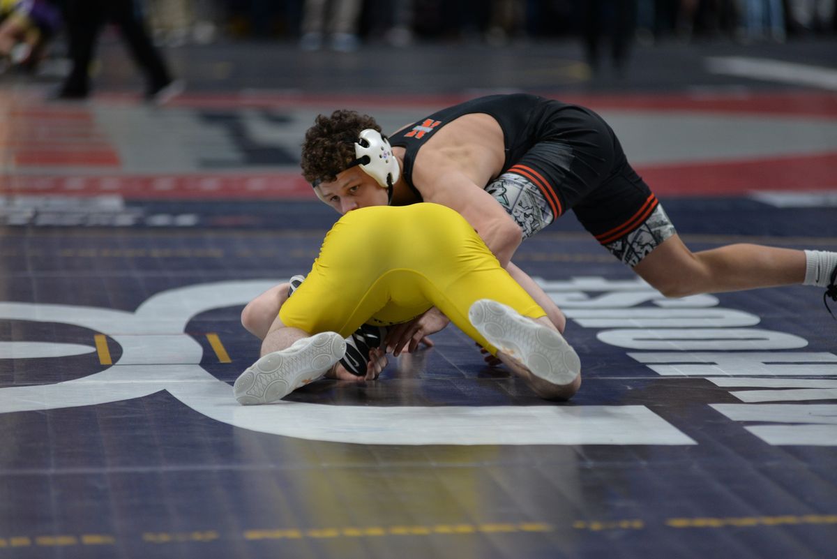 A Northampton wrestler drives his opponent to the mat