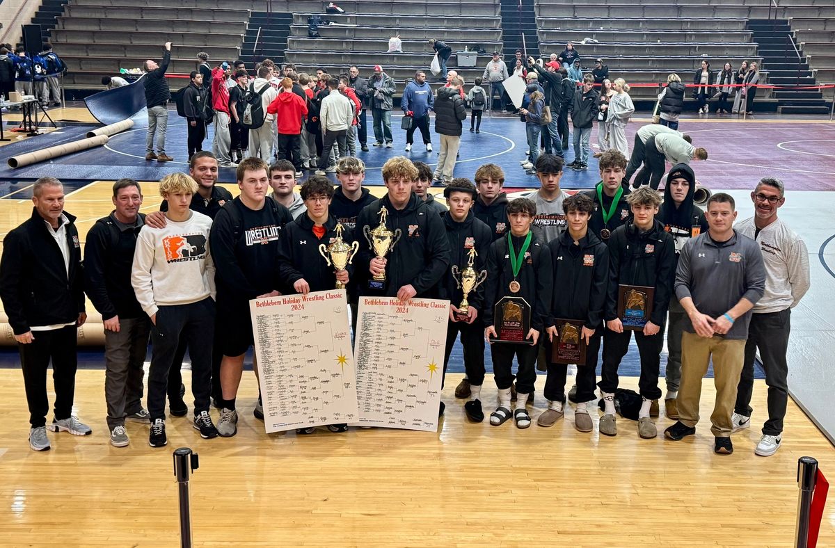 The Konkrete Kids with their trophies and brackets after a 2024–25 tournament title