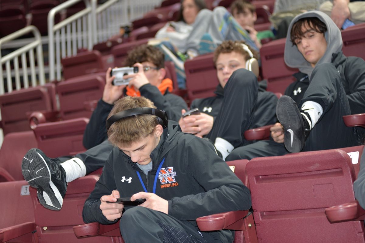 Northampton wrestlers wait in the stands at Hershey