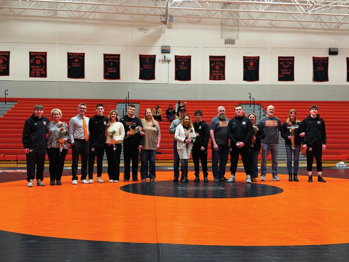 Northampton seniors and their families on the orange mat for Senior Night