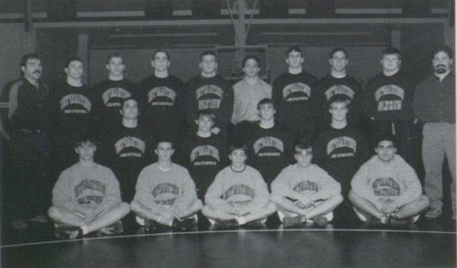 The 1997–98 Northampton team and coaches in the wrestling room
