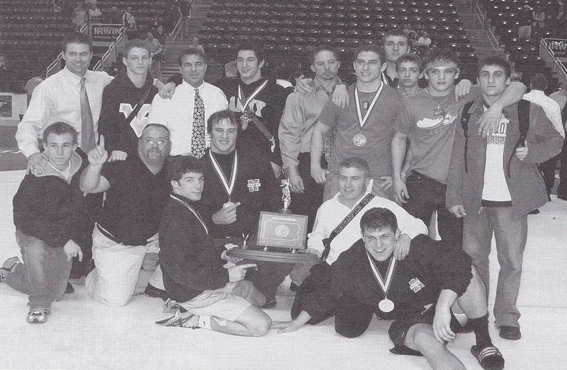 The 2003–04 Northampton team and coaches celebrate with the PIAA Class AAA team championship trophy